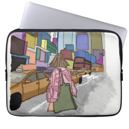 En kvinna går ner på en bustig stadsgata. laptop fodral