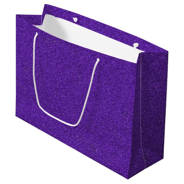 En lila glitterpresentpåse med vita handtag (Framsidan Vinklad)