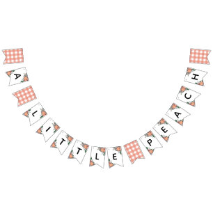 En liten persiko-babystövel vimplar