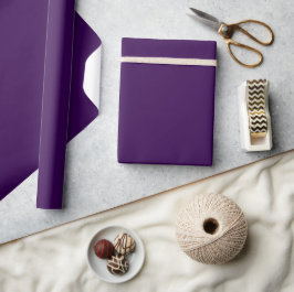 En minimalistisk lila bakgrund med subtil presentpapper