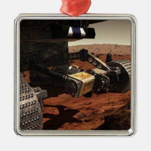 En närbild beskådar av armen på NASA fördärva Julgransprydnad Metall