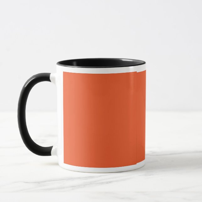 en orange med svart gräns mugg (Vänster)