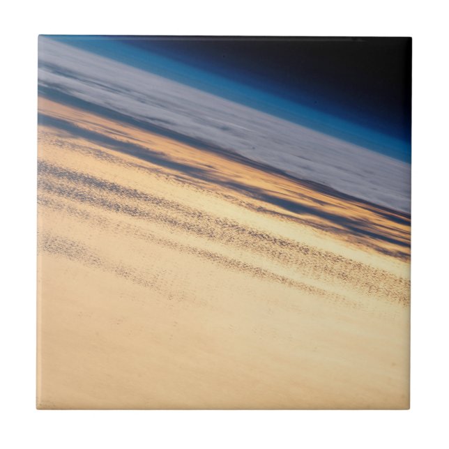 En Orbital-solnedgång utanför Baja Kaliforniens Ku Kakelplatta (Framsidan)