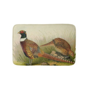 En para av ringen hånglade pheasants i ett gräs- badrumsmatta