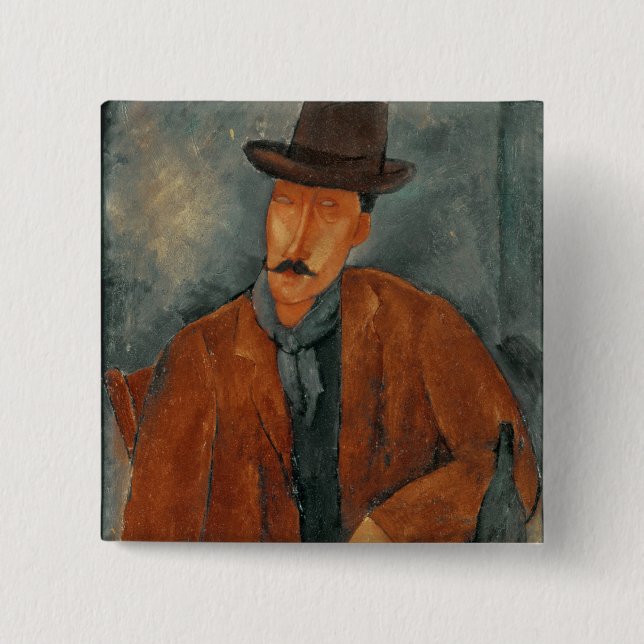 En placerad manbenägenhet på ett bord knapp (Framsida)