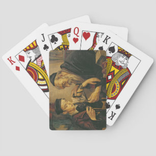 En rabbin som binder phylacteriesna till armen av casinokort