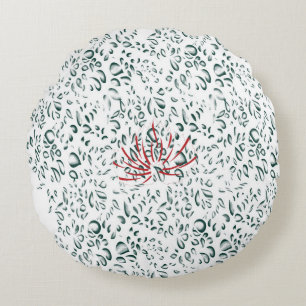 en röd blomma på en svart bakgrund rund kudde