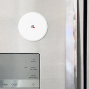 En röd hjärtsymbol skapat med ett jämnt, fetstilt magnet