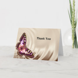 En rosa butterfly på en gräddsäcksbakgrund kort