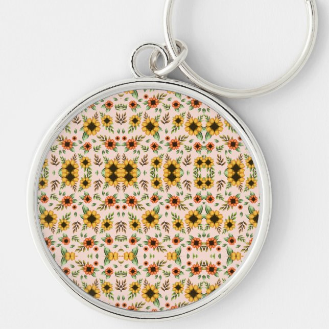 En rund nyckelring med ett blomster mosaik design (Framsidan)