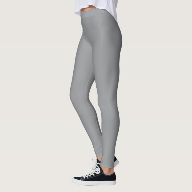 En slät ljusgrå tygstruktur leggings (Vänster)