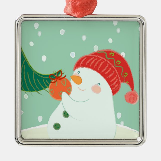 En snögubbe som hänger en prydnad på ett träd julgransprydnad metall (Framsidan)