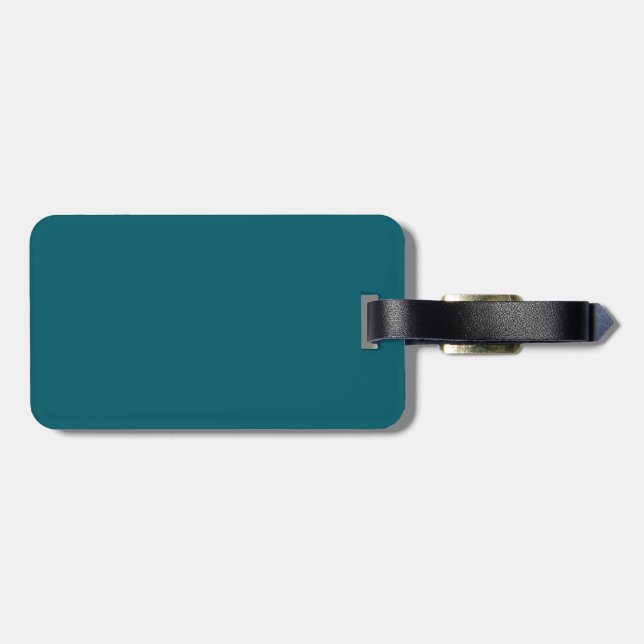 En solid teal bakgrund fyller bilden bagagebricka (Baksida Vågrät)