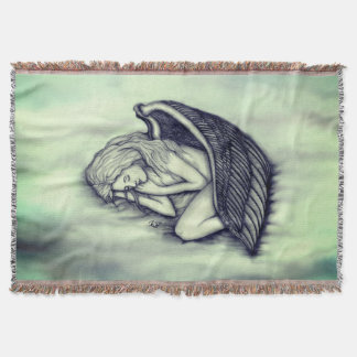 En sovande ängel på himmelmolnen i grönt filt