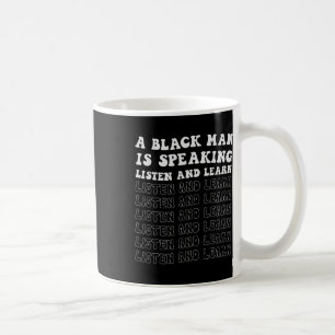 En svart man talar och lär sig svart. kaffemugg