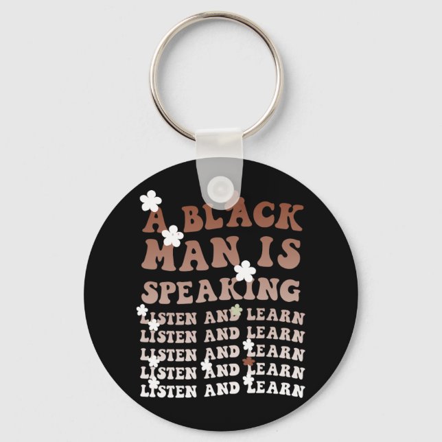 En svart man talar och lär sig svart. nyckelring (Framsida)