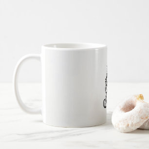 en svartvit bild av en ornerad design kaffemugg