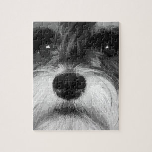 En svartvit miniatyrSchnauzer Pussel