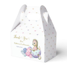 En tacklåda med en söt babyduschdrake.