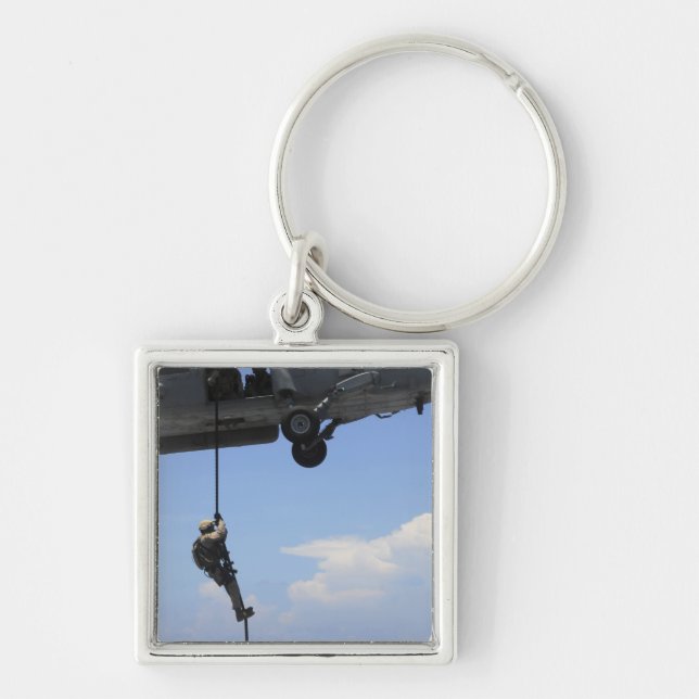 En tekniker för hantering av sprängämnesproppar fyrkantig silverfärgad nyckelring (Framsidan)