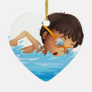 En ung pojkesimning med gula goggles julgransprydnad keramik