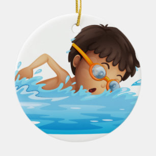 En ung pojkesimning med gula goggles julgransprydnad keramik