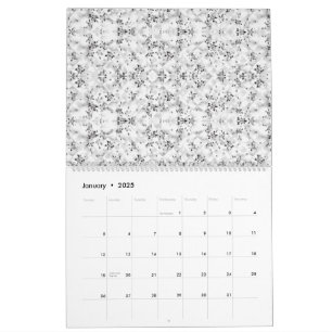 En visuellt slående vit och svart mönstrad vägg kalender