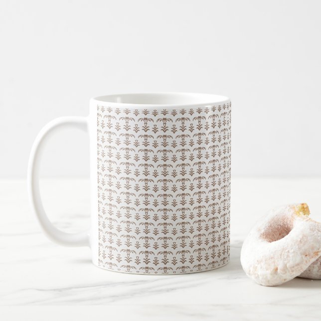 en vit bakgrund med brunt mönster på den kaffemugg (Med munk)