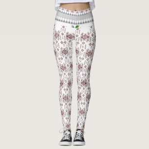 en vit bakgrund med röd mönster på den leggings