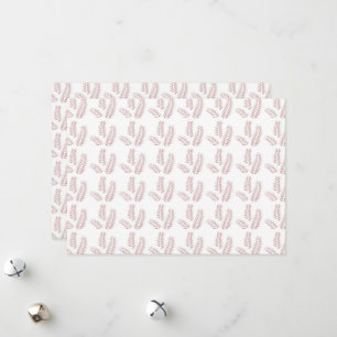 en vit bakgrund med rosa löv på den julkort
