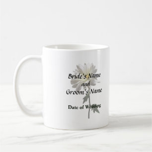 En vit Daisy Kaffemugg