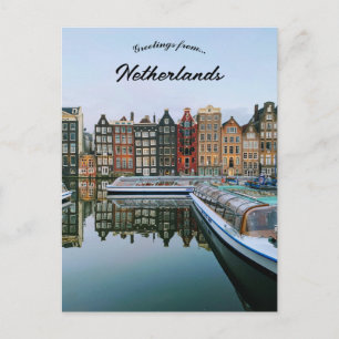 En vy över Amsterdam Nederländerna Vykort