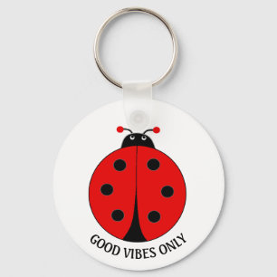 Endast bra vibrationer Lady Bug på vit Nyckelring