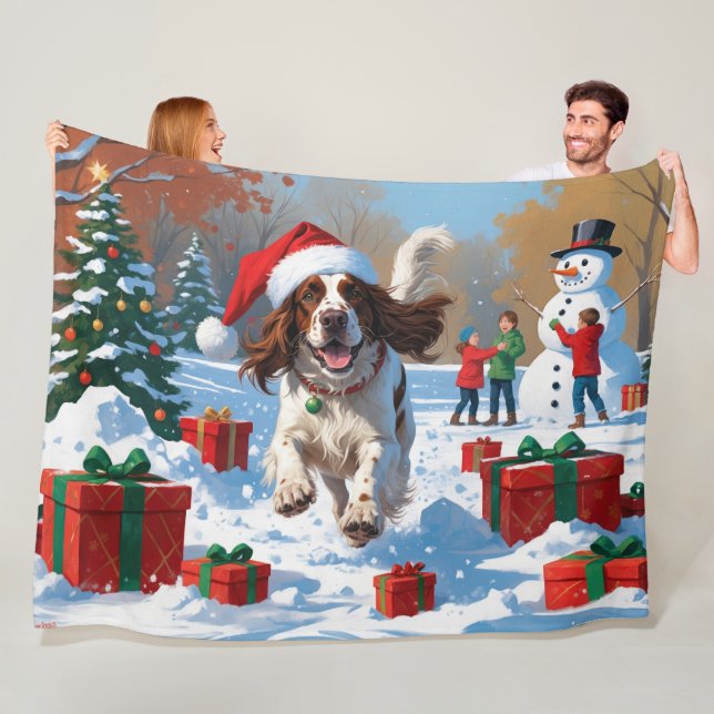 Engelsk Setter som springer i snö med julhatt Fleecefilt (På plats)
