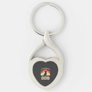 Enkel man som älskar hund Siluett Solnedgång Palm  Twisted Heart Silverfärgad Nyckelring