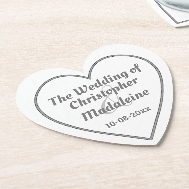 Enkel silvergrå bokstavsstil på en pappersunderläg underlägg papper (Vinklad)