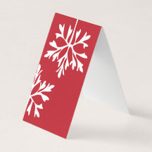 Enkel snöflinga på den röda bakgrunden