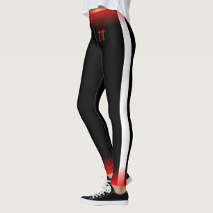 Enkel vit rand på svart med röd och T&T-text Leggings