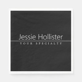 Enkel, vit text i klass på svart pappersservett