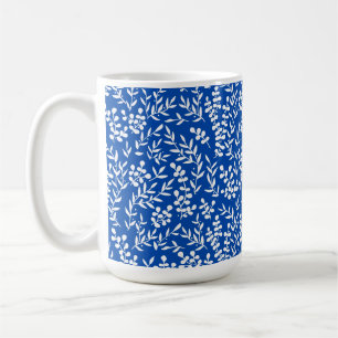 Enkelt blommönster om blått kaffemugg