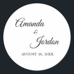 Enkla svarta och vita kalligrafifärer runt klistermärke<br><div class="desc">Detta enkla svarta och vita kalligrafklistermärke ger en lyx för eleganten, men samtidigt en modernt känsla för både ett minimalistiskt och mer traditionellt eller formellt bröllop eller för evenemangsposteringar och favoriter. Avslappnadens kalligrafi gör att du kan känna dig antikt, medan utformningen av klassens neutralt kan kombineras med alla unika aspekter...</div>