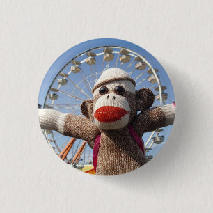 Ernie som sock monkeypariserhjulen klämmer fast knapp