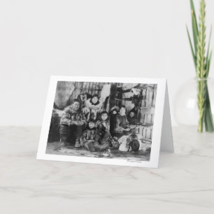 Eskimåfamiljen i vinterIgloo fotograferar Kort