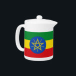 Etiopiens Flagga Tekanna<br><div class="desc">Etiopiens Tekanna kombinerar funktionalitet med det nationella pridet och erbjuder ett vackert sätt att ditt favoritte samtidigt som man firar det pulserande färg och den etiopiska flagga symbolik. Tekannan har flagga ikoniska grönt, gult och röda färg, tillsammans med blåcirkeln och stjärnornas emblem, skapar den som ett slående tillägg till din...</div>