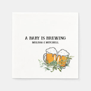 Ett baby brinner pappert i par babyduschen pappersservett