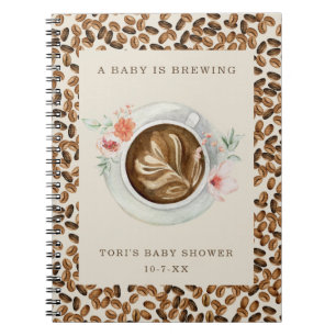 Ett Baby håller på att blåsa Blommigt-kaffebabysko Anteckningsbok