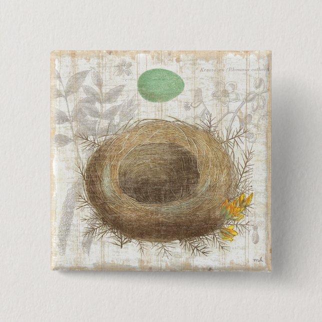 Ett fågelbo med ett grönt ägg knapp (Framsida)