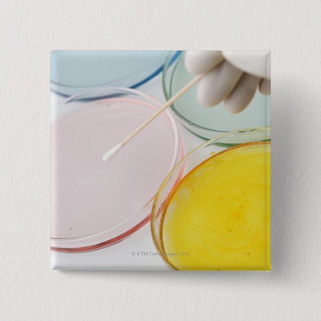 Ett glimmat handprov av petrie i plast knapp (Framsida)