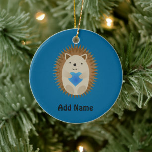 Ett obehagligt Hedgehog kramar ett blått hjärta Julgransprydnad Keramik
