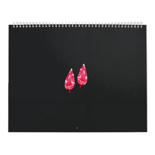 ett par röda löv i svart bakgrund kalender